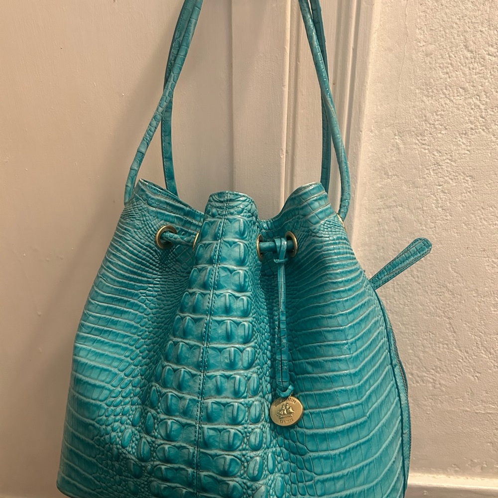 Brahmin Aqua “Trina” Drawstring Bag in “Capri”
11.5”H X 13”L X 6”D  NWO tags